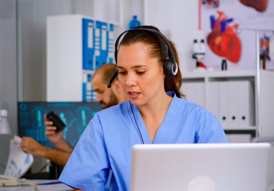 specialist-doctor-nurse-with-headphones-checking-appointment