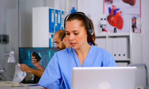 specialist-doctor-nurse-with-headphones-checking-appointment